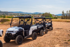 UTV. ATVs stand in a row.Quad bike with a roof. ATVs for travel